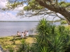 Friends sitting at the picnic tables at Lake Shelby in Gulf State Park