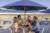 Friends dining at Coastal beachfront restaurant in Orange Beach