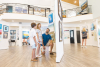 A family visiting the Coastal Arts Center of Orange Beach