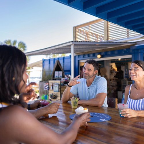 People dining outside at The Gulf waterfront restaurant in Orange Beach