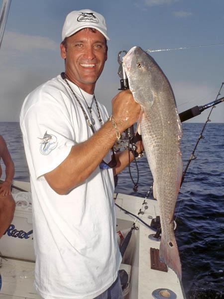 Man holding red fish Orange Beach