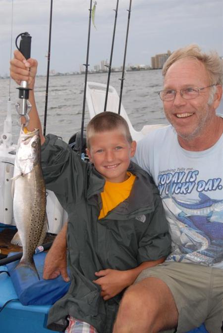 Young boy with speckled trout Orange Beach Al