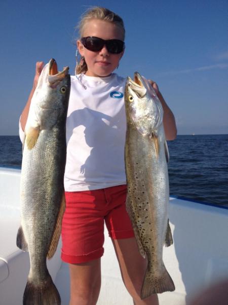 Girl holding two fish