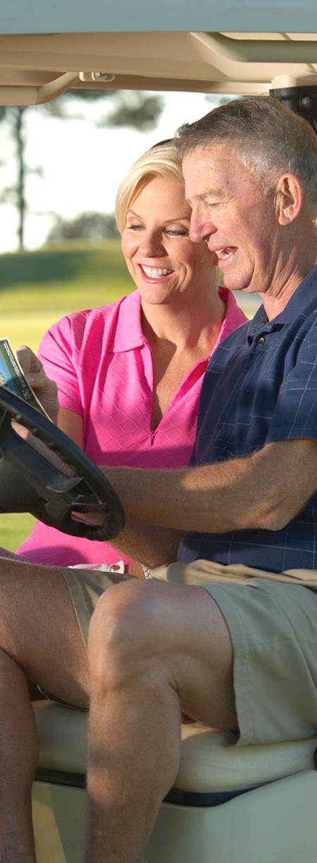Couple golfing in Gulf Shores
